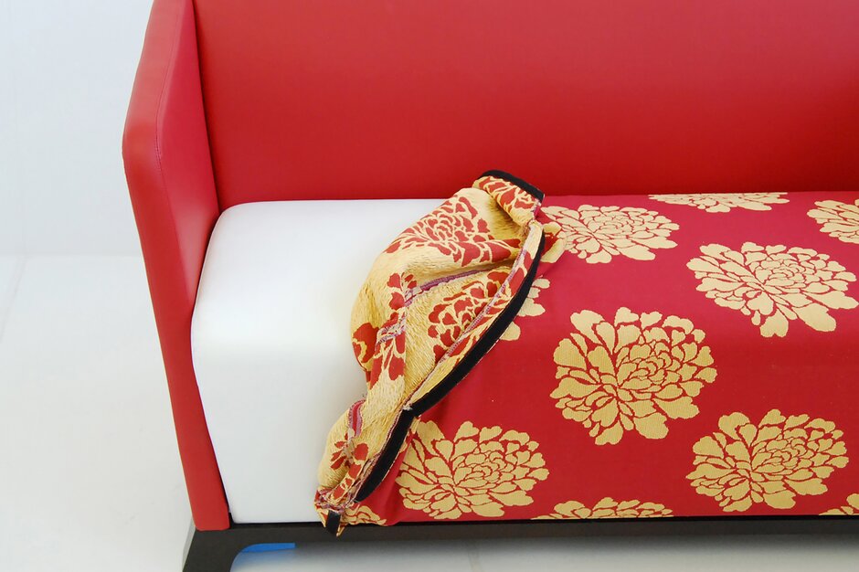 Red bench with detachable cover.