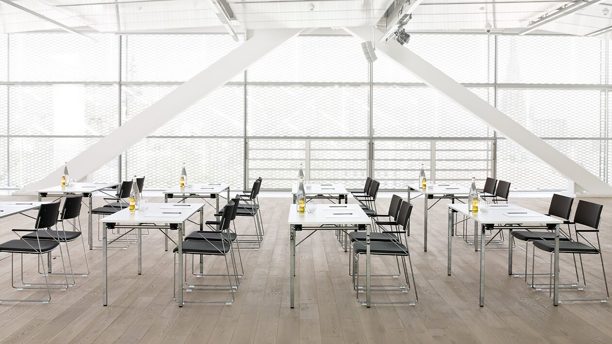 seminar room with tables and chairs.