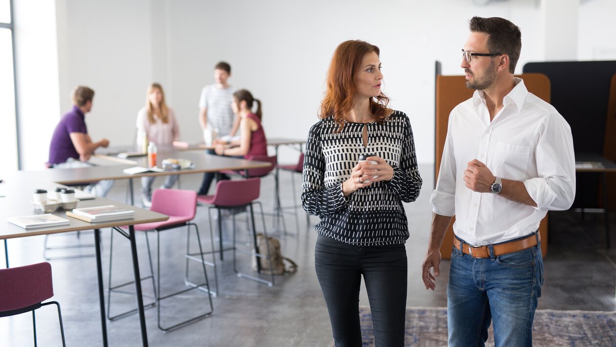 Two people talking with each other.