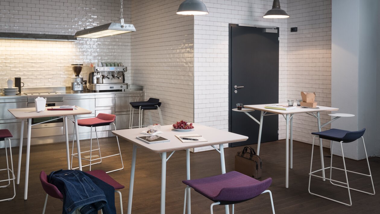 Kitchen with tables and barstools.