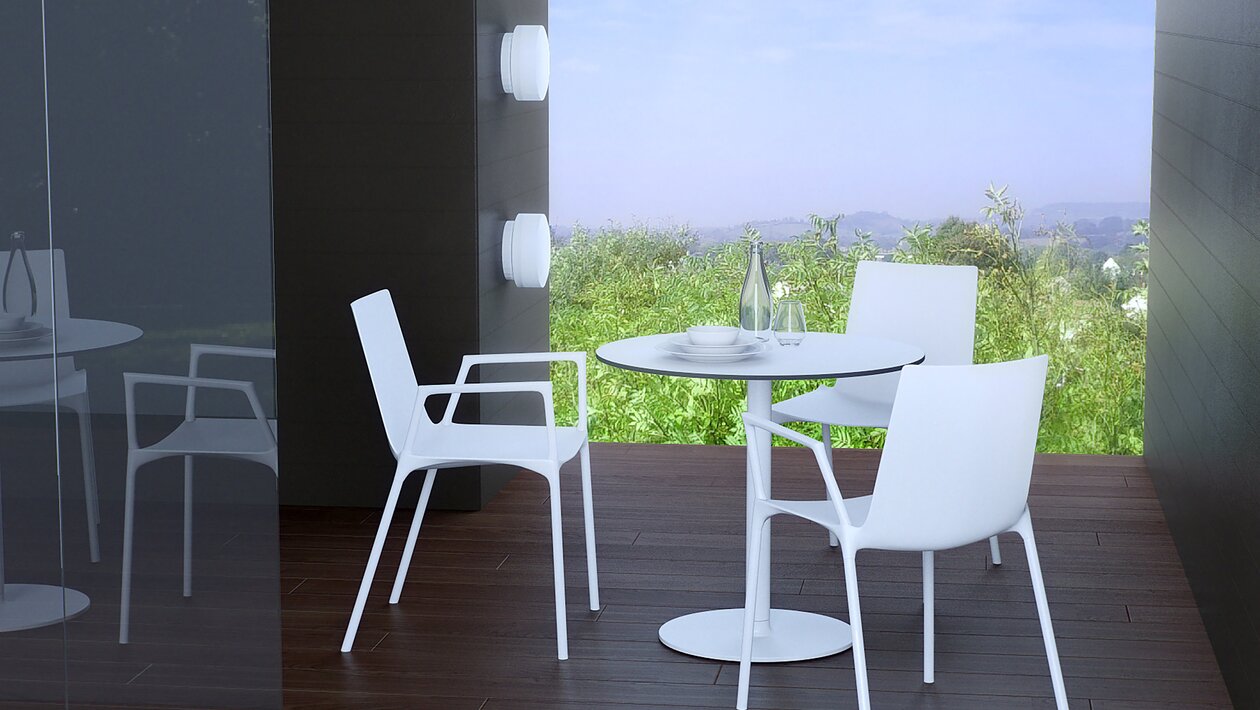 White chairs with a white bistro table.