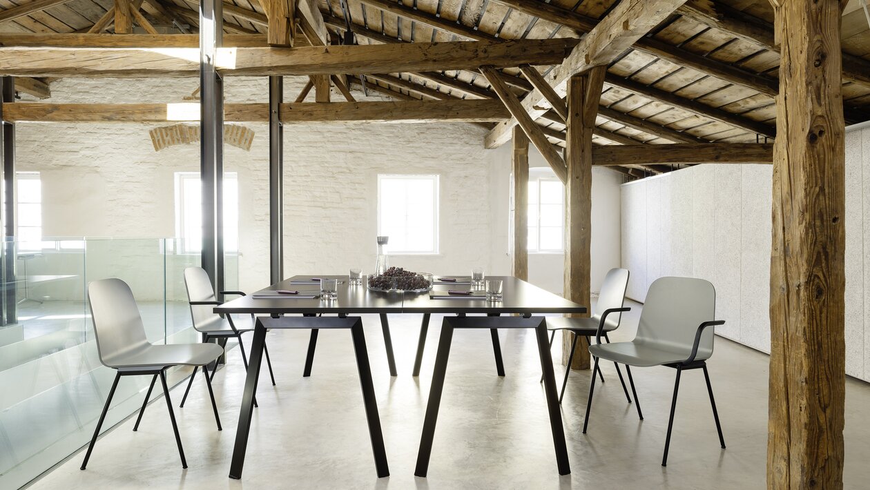 Black folding table with four chairs.