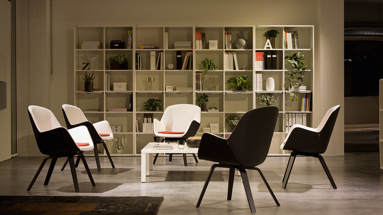 Conference chairs in front of a book shelf.