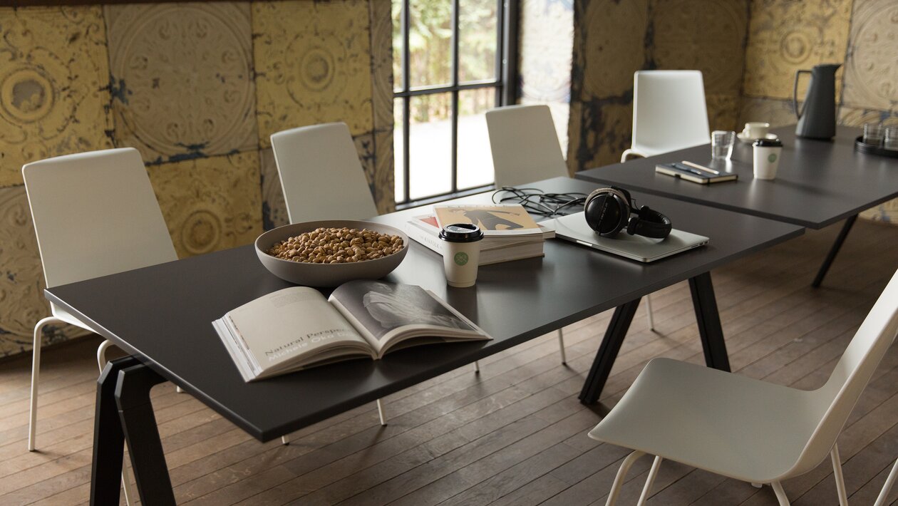 Black tables with white chairs.