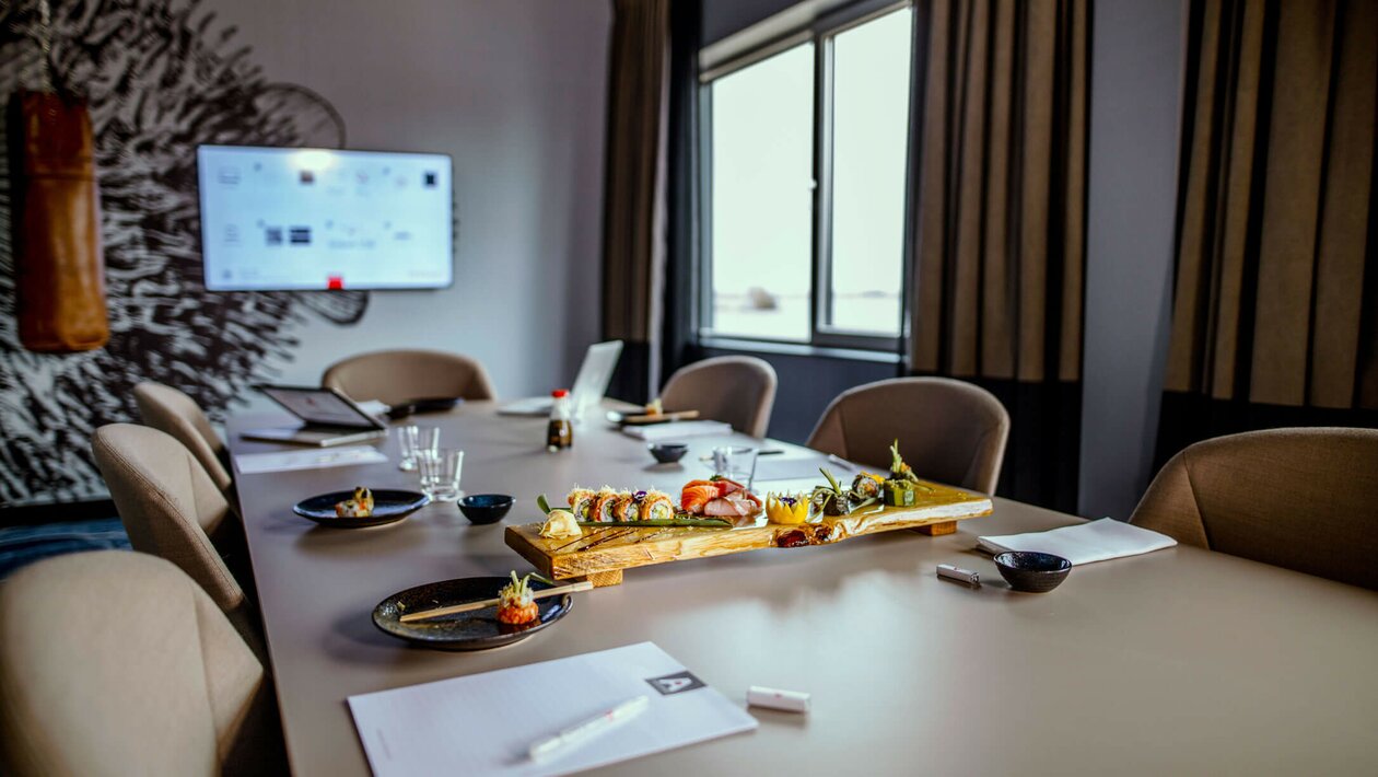 Conference room with tables and chairs.
