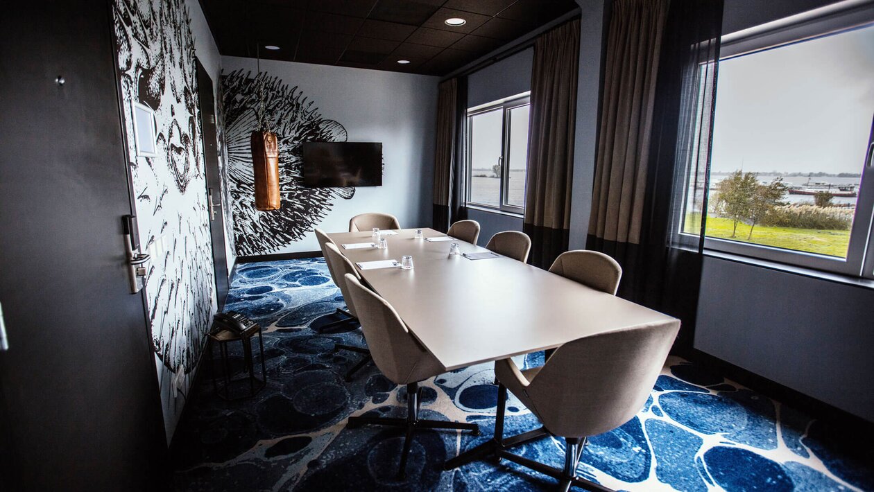 Conference room with conference table and chairs.
