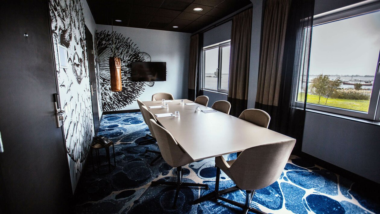 Conference room with conference table and chairs.