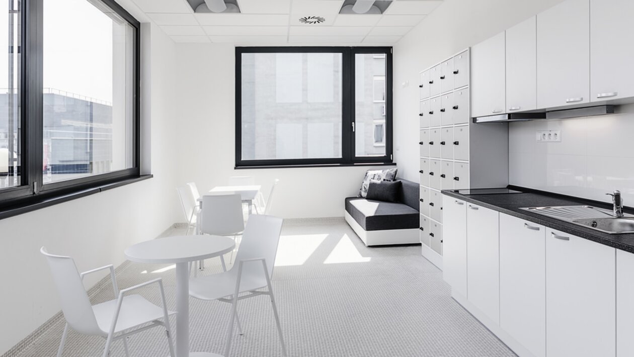 Light kitchen with white furniture.