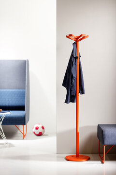 Orange coat stand.