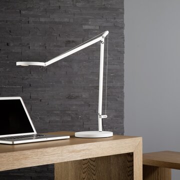 White lamp at a desk.