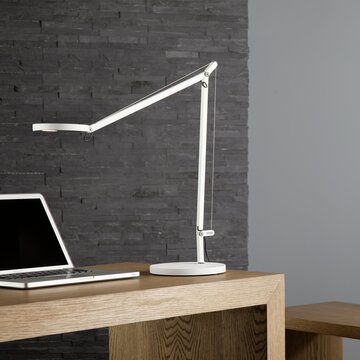 White lamp at a desk.
