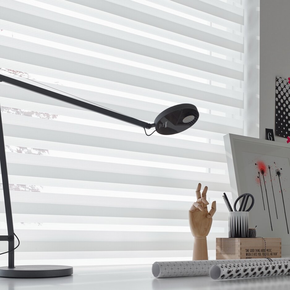 Black lamp on a desk.