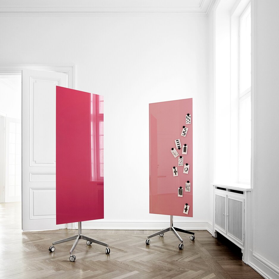 Two pink glass writing boards.