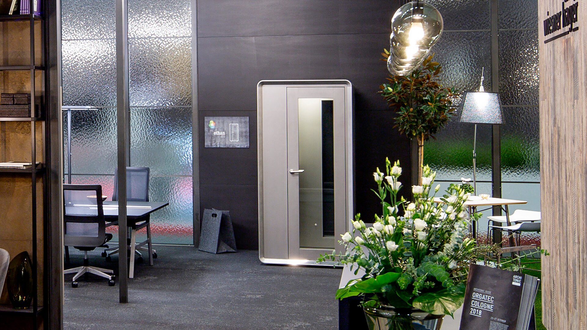 Gray phone box in an office.