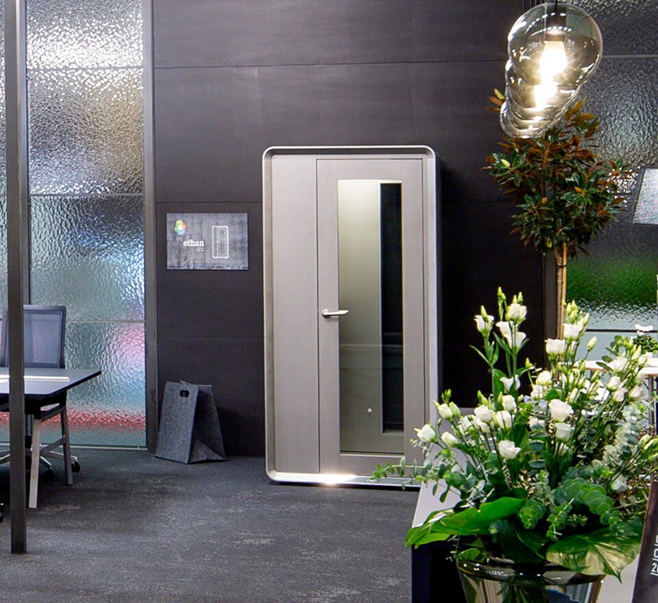 Gray phone box in an office.