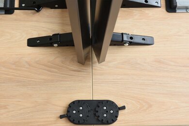 Detailed view of the linking device of a folding table.