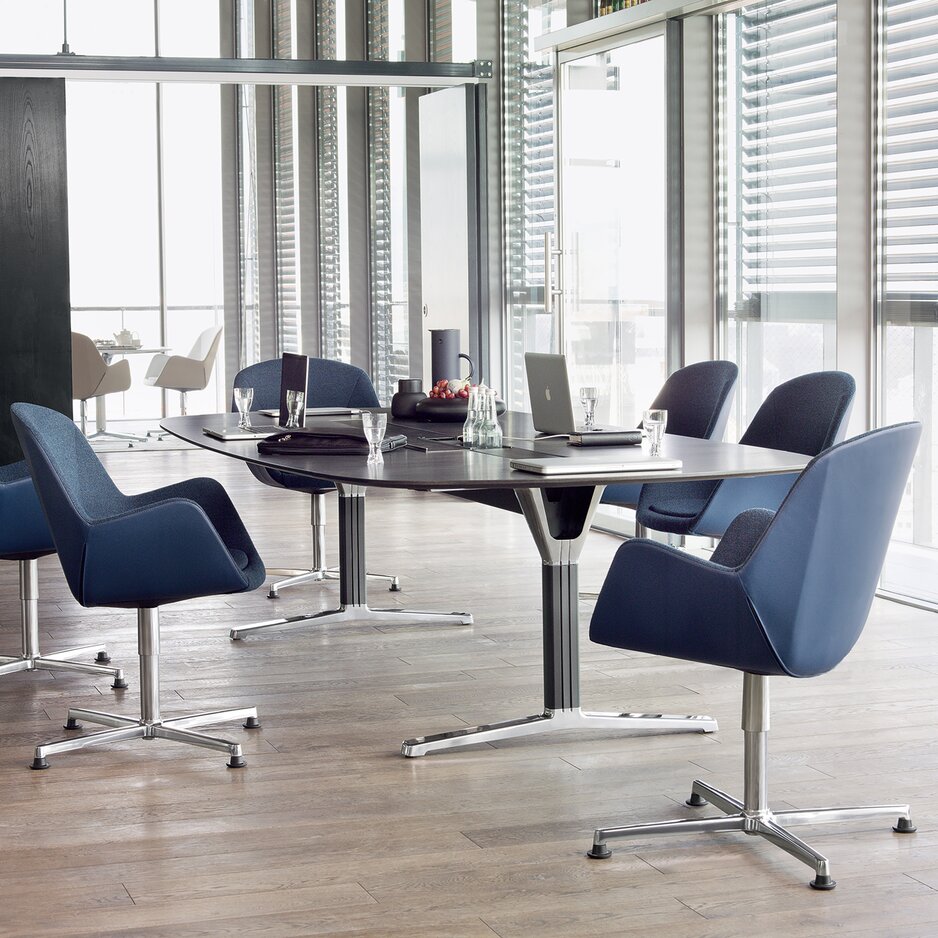 Conference table with blue conference chairs.