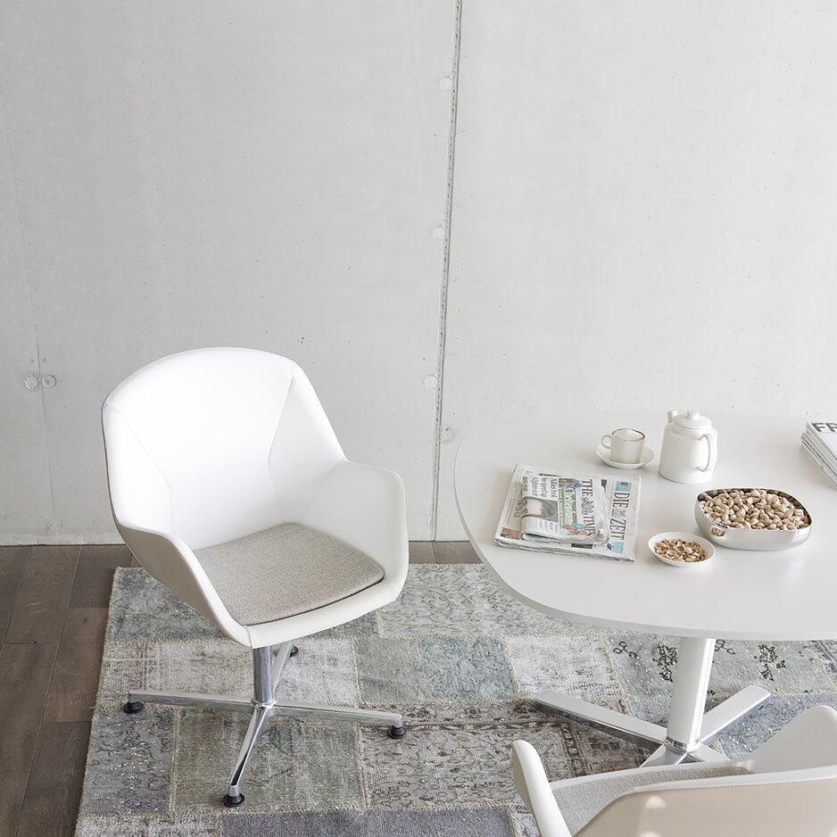 White conference chair at a bistro table.