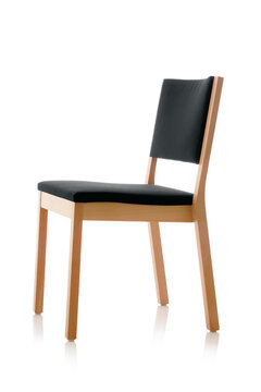 Wooden chair with black padded seat and back.