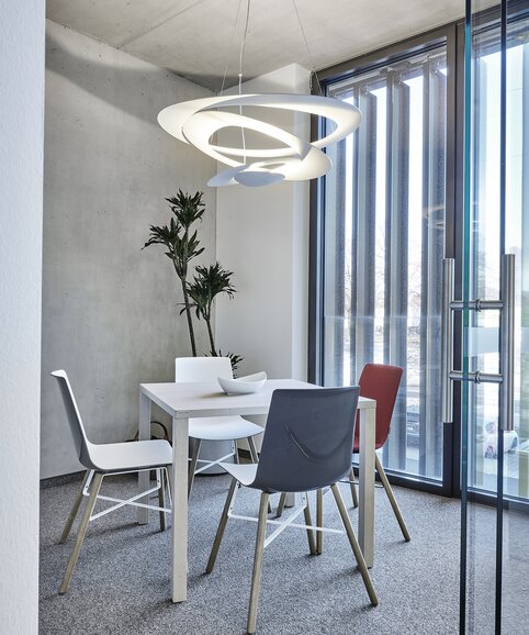 White table with three chairs.