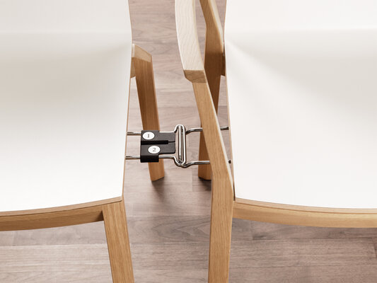Element waarmee twee stoelen met elkaar verbonden worden zodat stoelen in een rij kunnen worden opgesteld