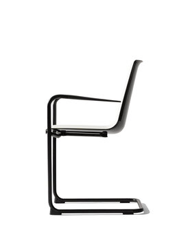 White cantilever chair with black arms. 