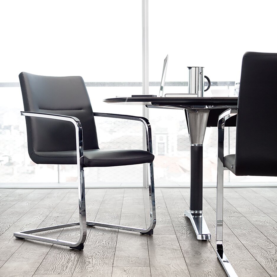 Black cantilever chair in an office.