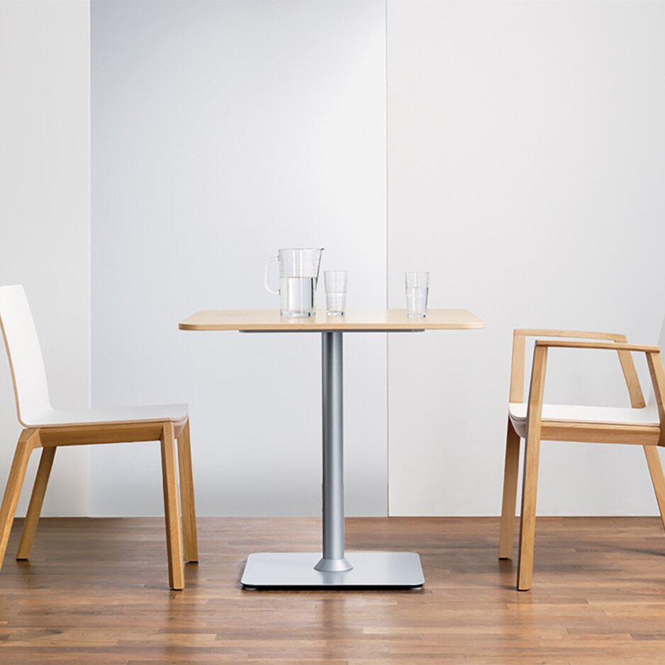 Two wooden chairs in a café.