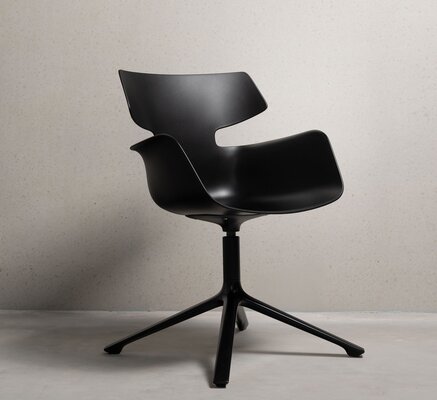 Black shell chair with four legs
