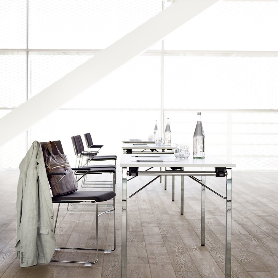 Tables and chairs in a light room.