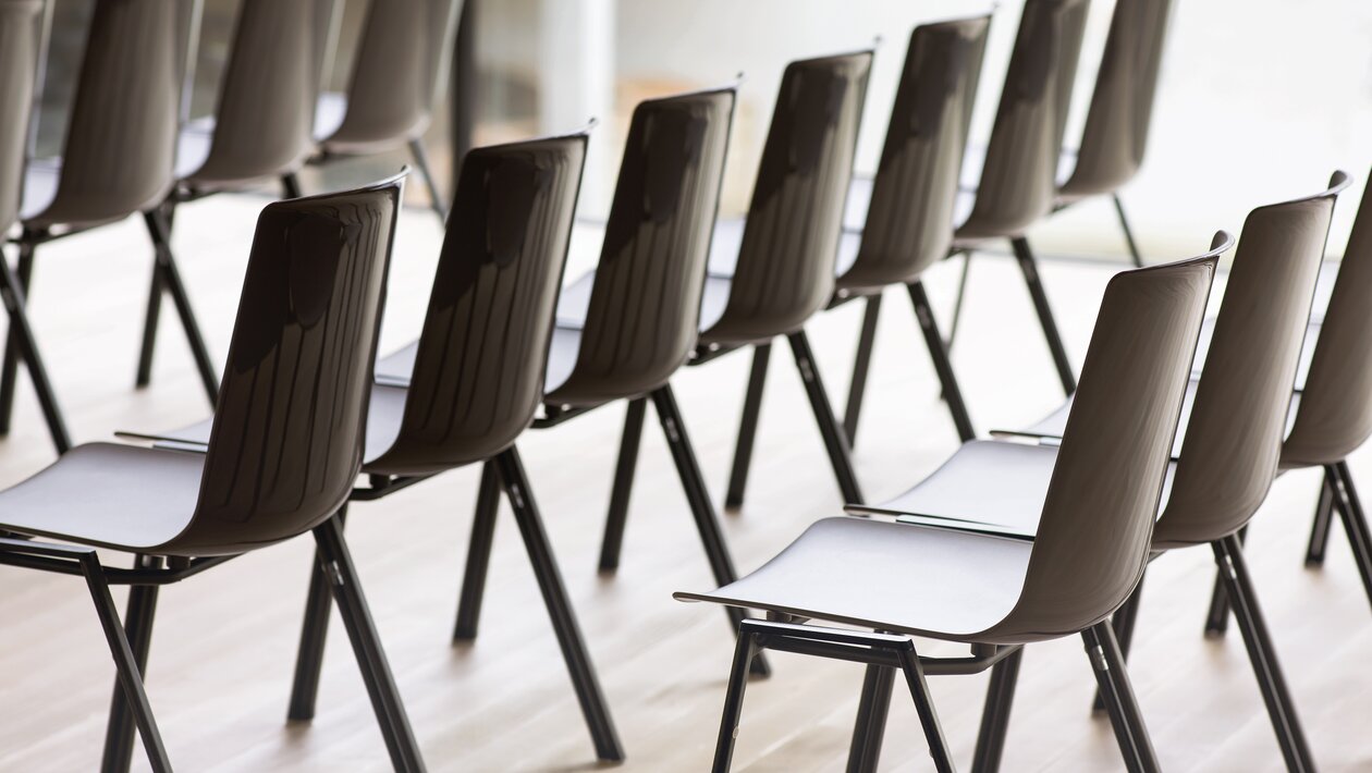 Rows of black linking chairs.