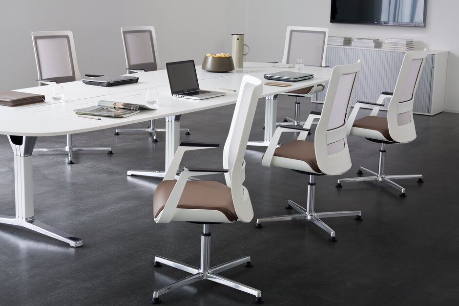 poi conference chair White conference chairs at a white conference table.