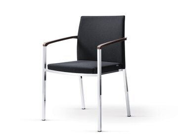 Black padded stacking chair.
