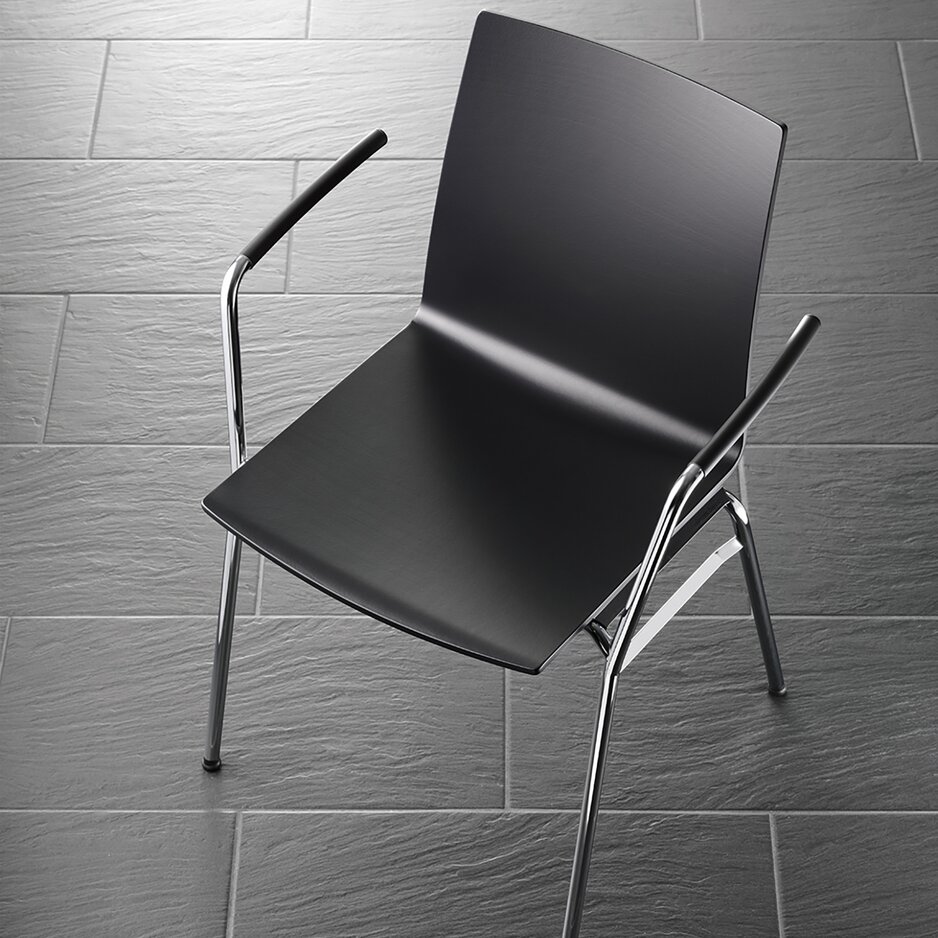 Black row chair photographed from above.