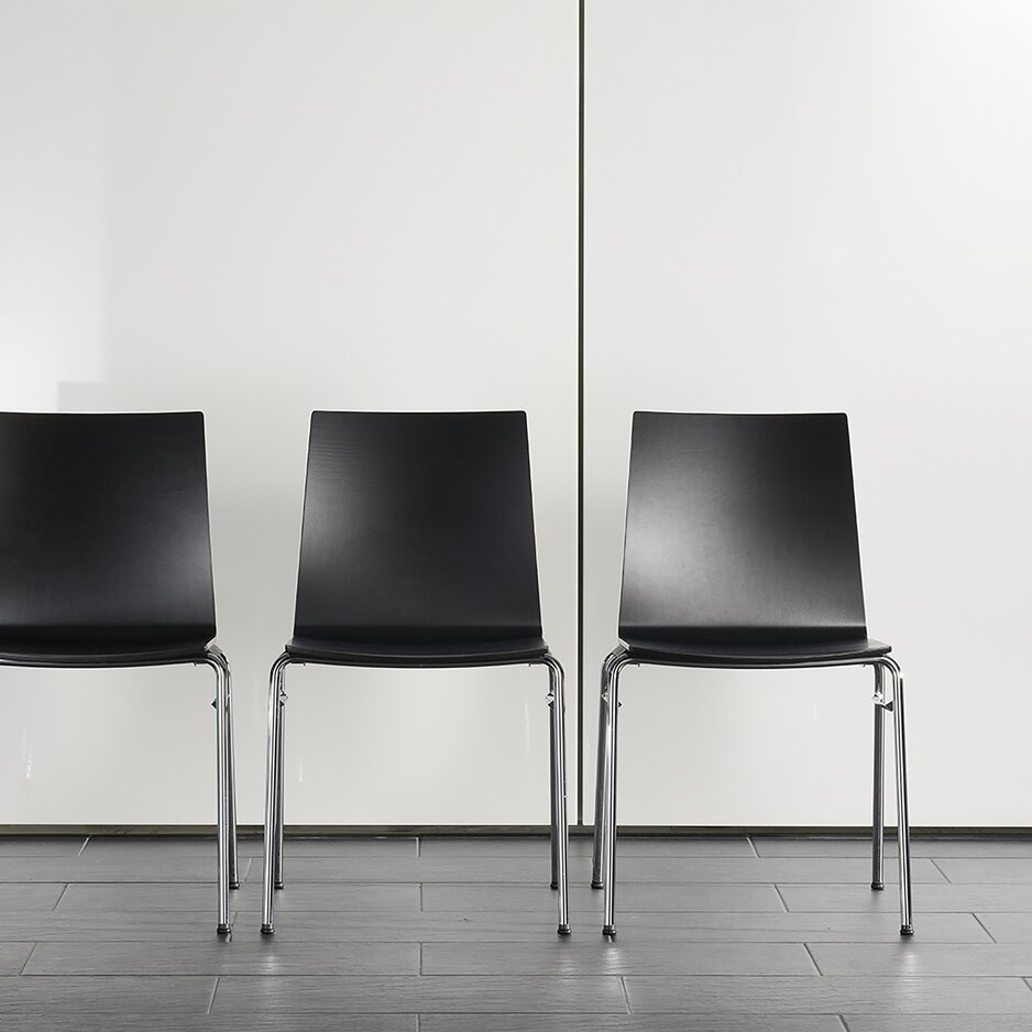 Three black row chairs.