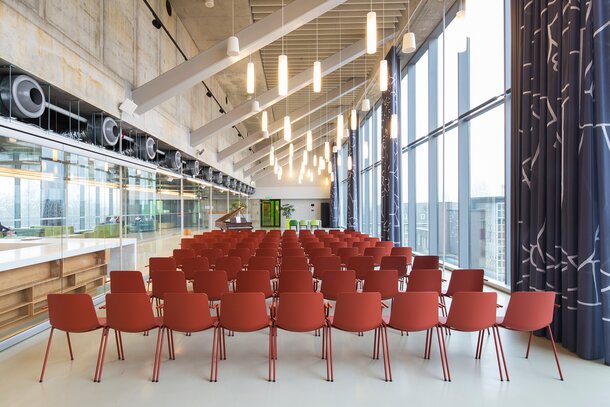 Rows of red chairs. | © Etienne Oldeman Photography