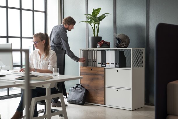 Two person in an office.