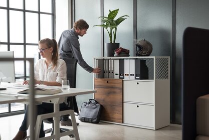 Two person in an office.