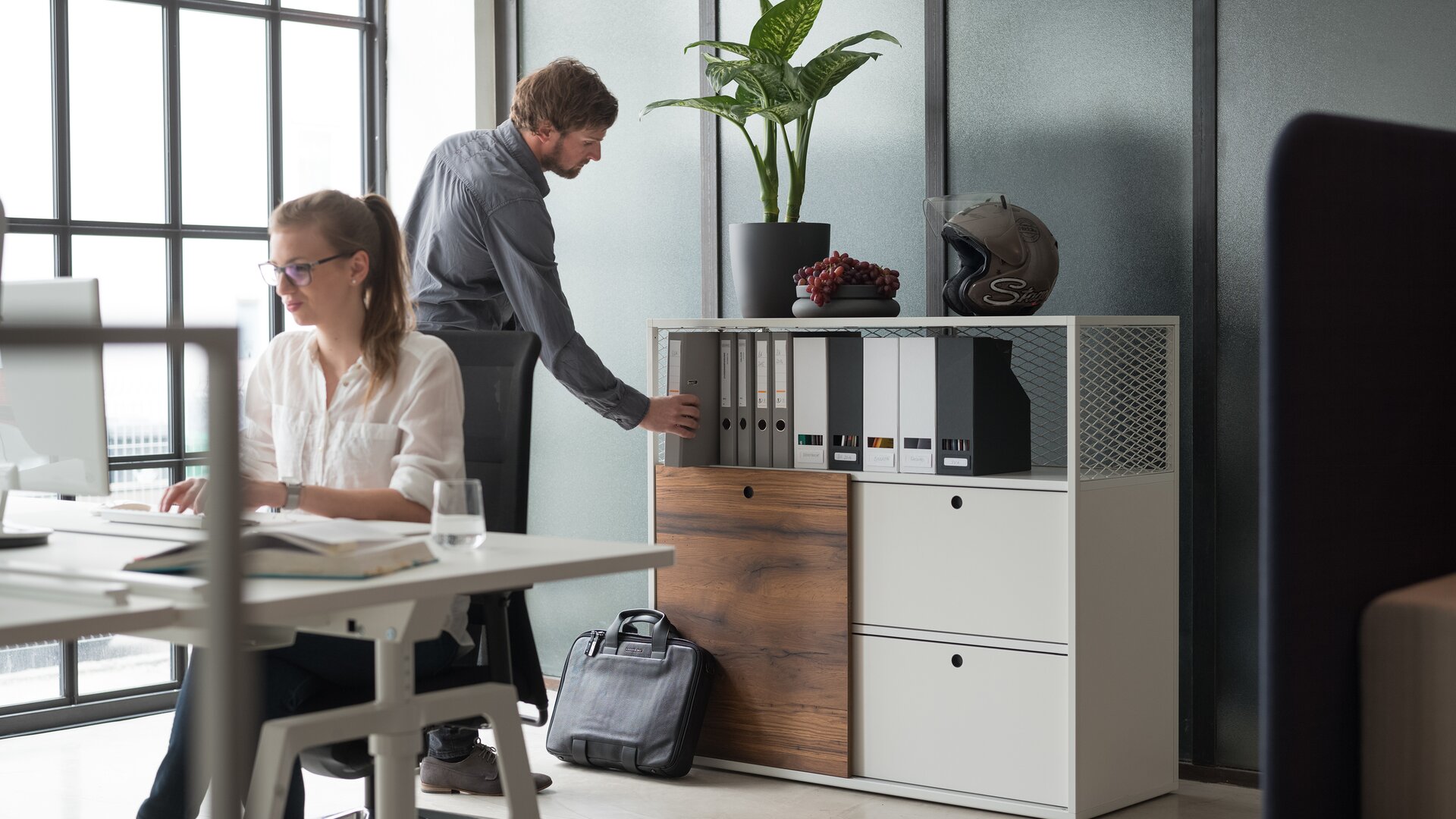 Two person in an office.