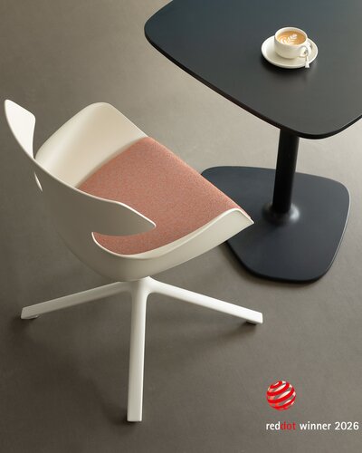 White shell chair with red upholstery and four legs