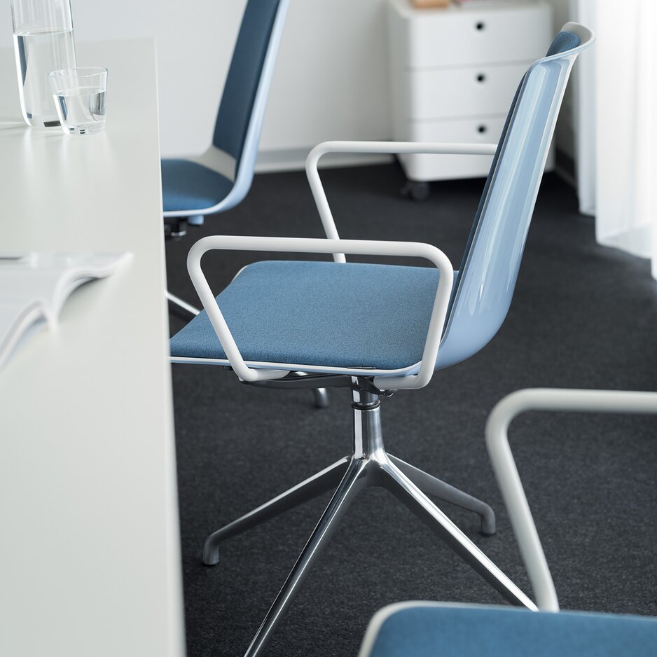 Detailed view of a blue conference chair.
