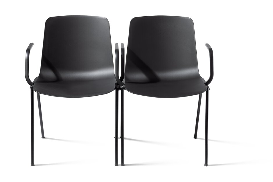 Two black linked chairs.