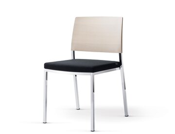 Stacking chair with black padded seat.