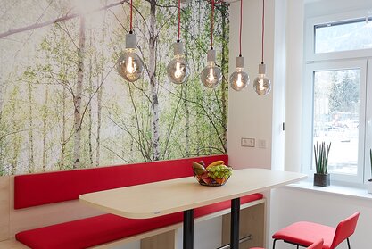 AHT | © Metcon Kitchen with red bench, high table and red barstools. | © Metcon