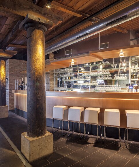 Bar with white barstools.