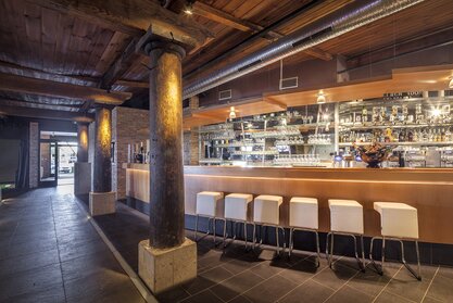 Bar with white barstools.