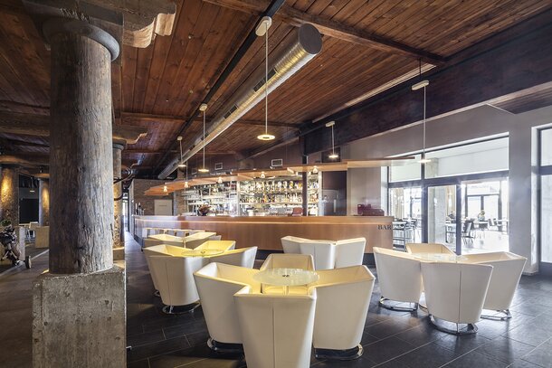 Bar with white armchairs.