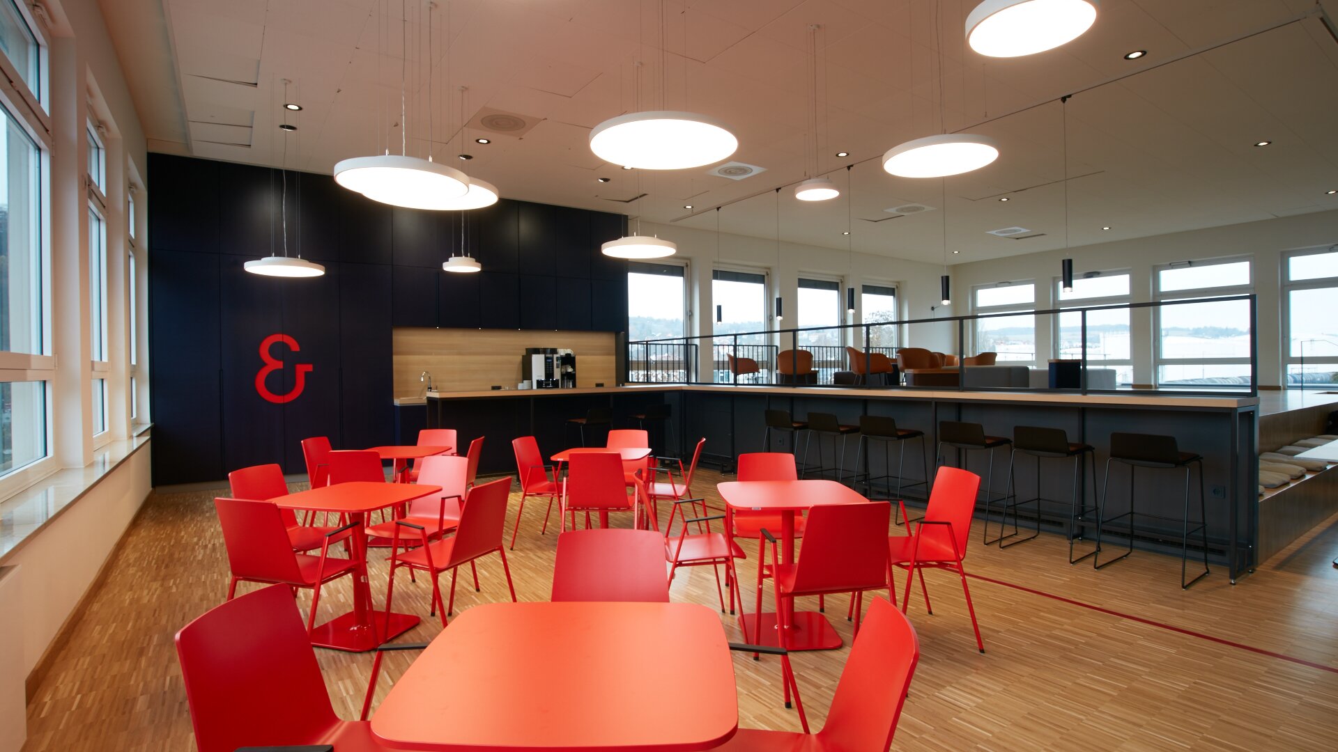 Café with red tables and red chairs. | © Peter Becker GmbH