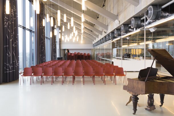 Rows of red chairs. | © Etienne Oldeman Photography