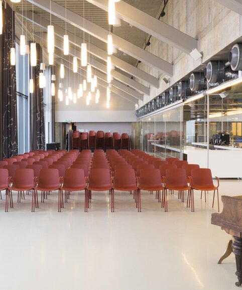 Rows of red chairs. | © Etienne Oldeman Photography